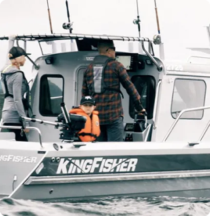 Woman catching a fish on a pretty good boat
